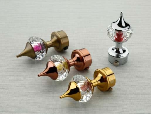 Curtain bracket finials with crystal and metal finishes